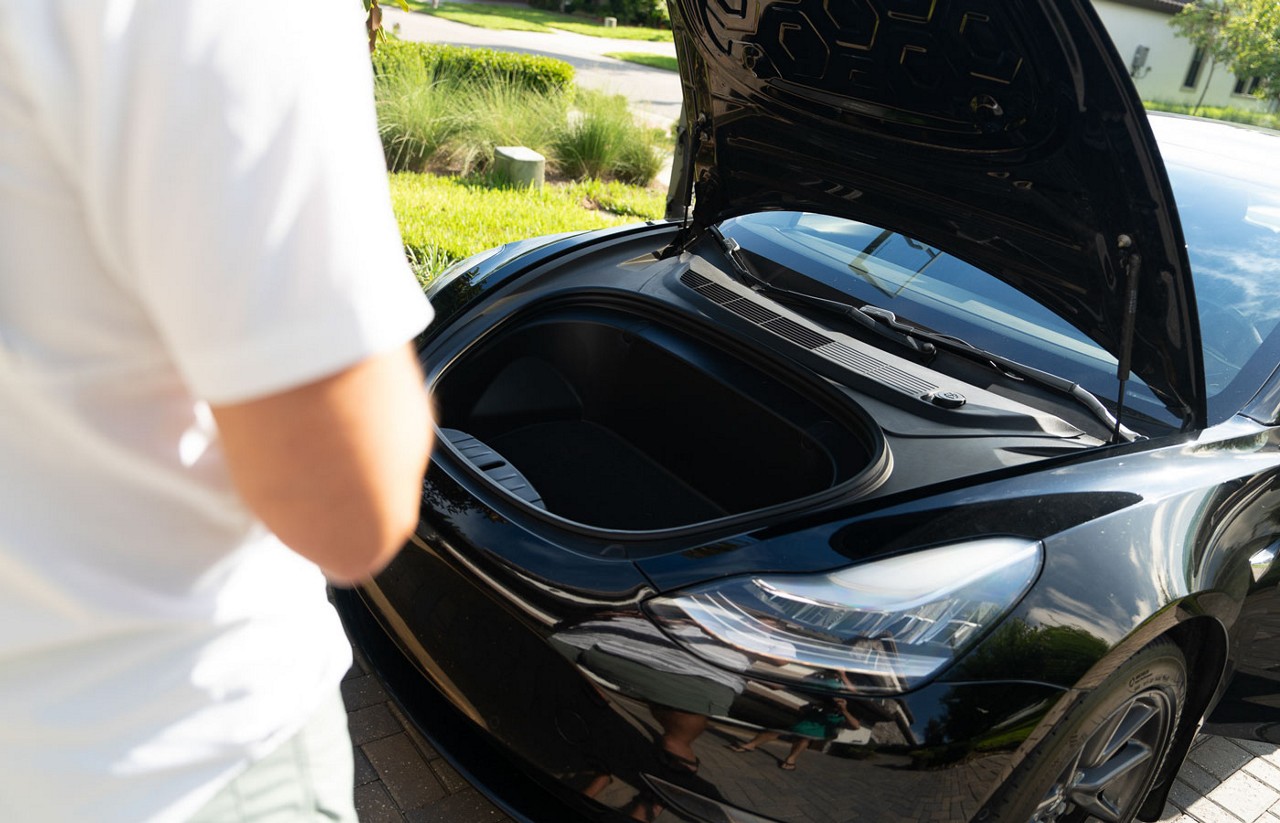 A close up look at the front trunk or frunk of an EV or electric vehicle