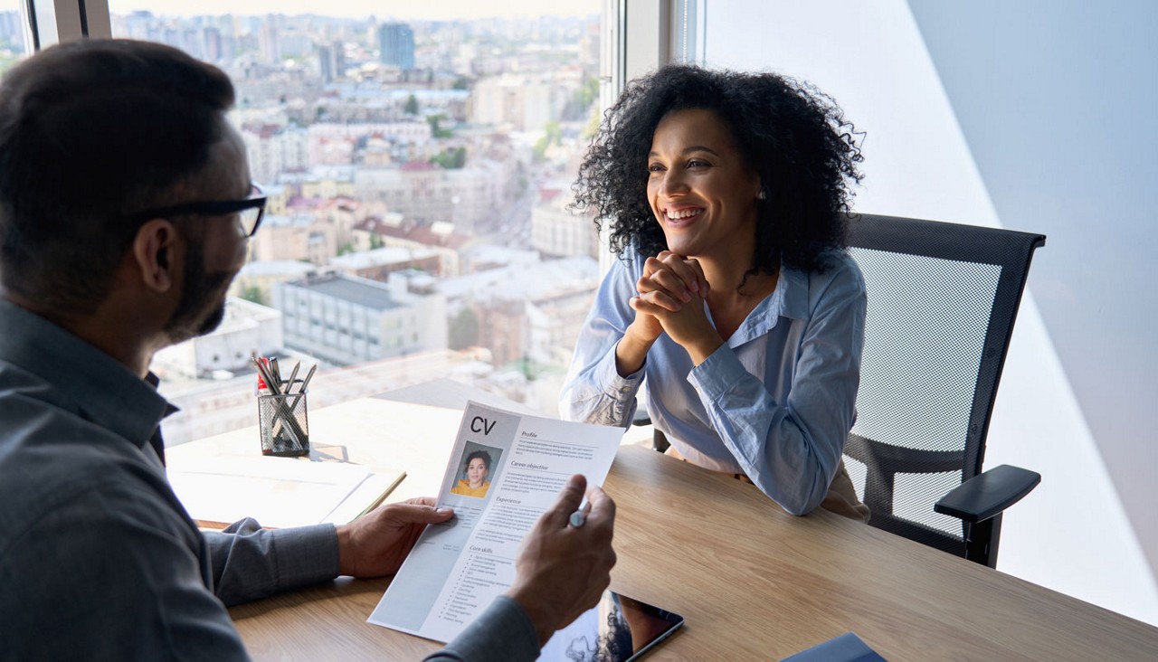 Interview between male adult and african american applicant.